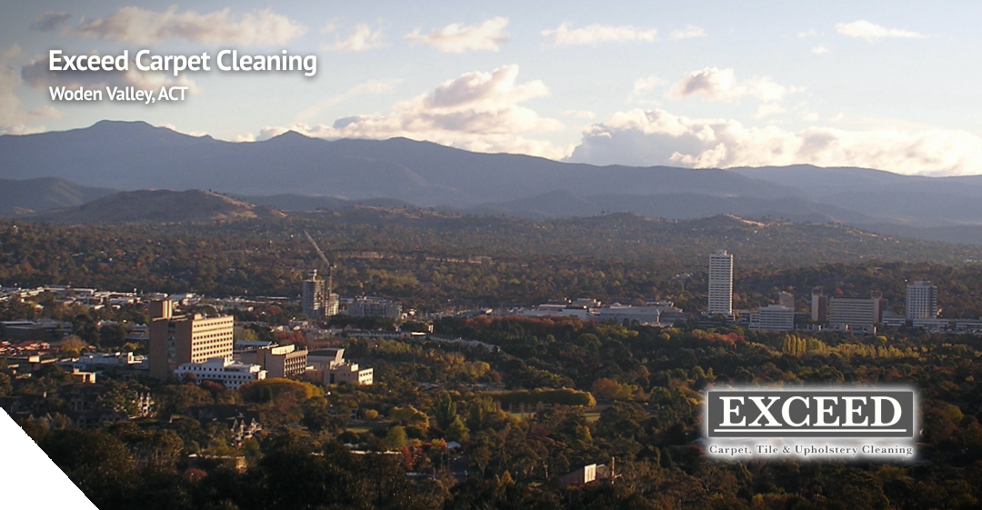 Woden Valley landscape with mountains, showcasing Exceed Carpet Cleaning branding, emphasizing professional cleaning services in ACT.