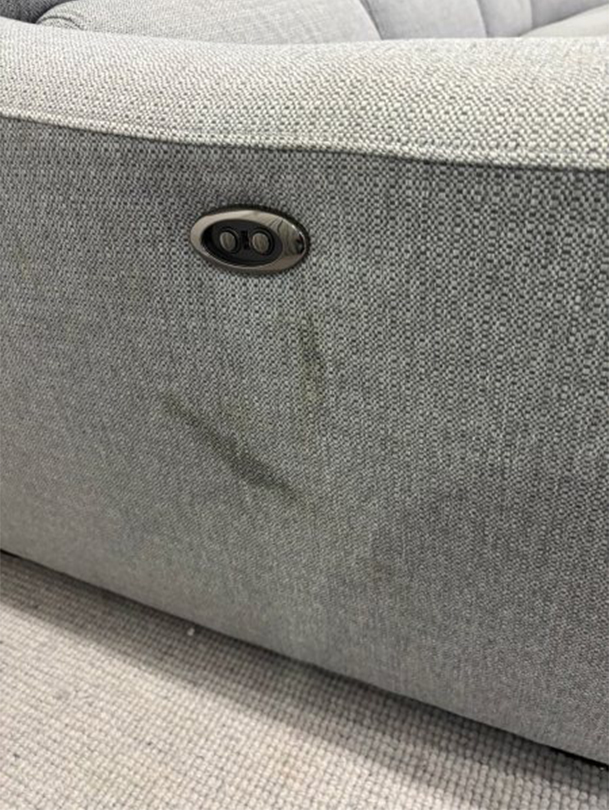 Upholstery with visible lip gloss stain and rough texture on lounge chair in a home setting, highlighting the need for professional cleaning services in Googong.